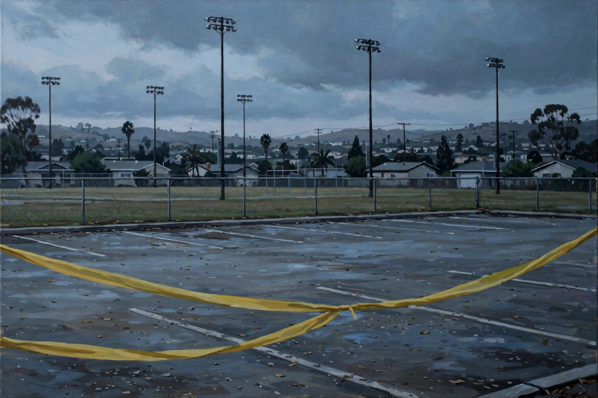 Empty California sports complex parking lot behind police tape at dusk