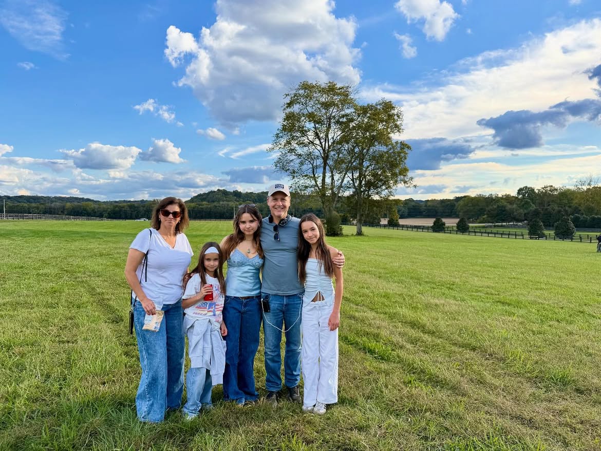The Lowe family together in a green field