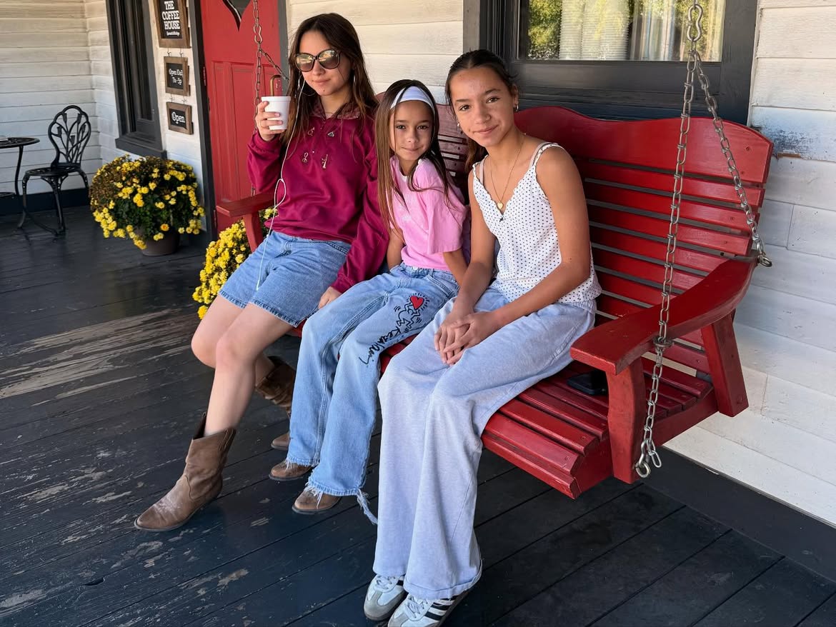 The three Lowe sisters on a porch swing
