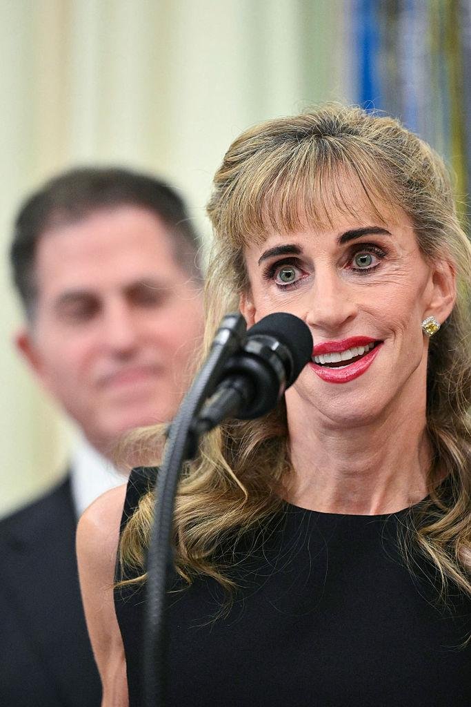 Susan Dell speaks at a White House podium during the Trump Accounts announcement